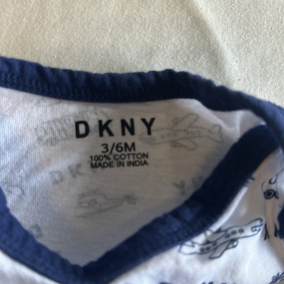 DKNY - White and Navy Baby Onesie with Airplane Design - Picture 3 of 3
